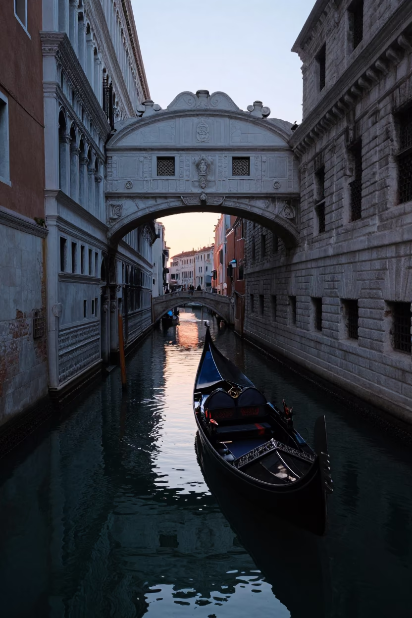 Venetian Canal Sunrise with Traditional Gondola and Stone Bridge in in Venice, Italy