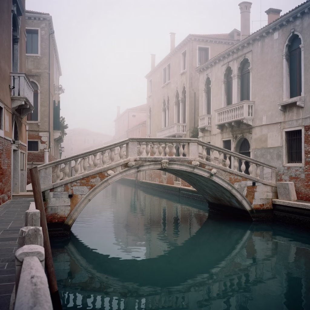Venetian Dawn Mist Drifts Over Historic Canal Bridge And Water in in Venice, Italy
