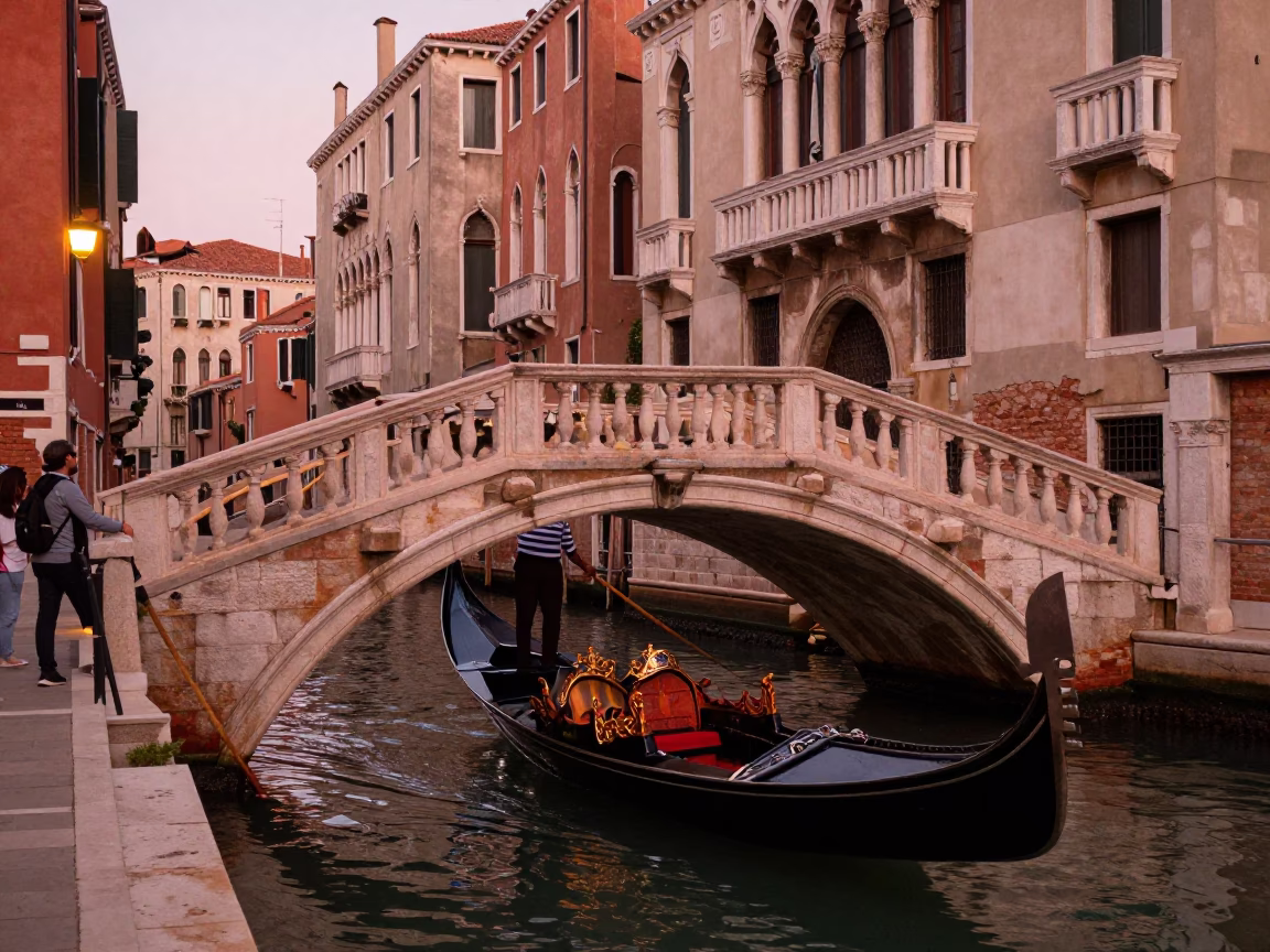 Venice Canal Bridge at Dusk with Gondolier and Tourists in Copper Light in in Venice, Italy