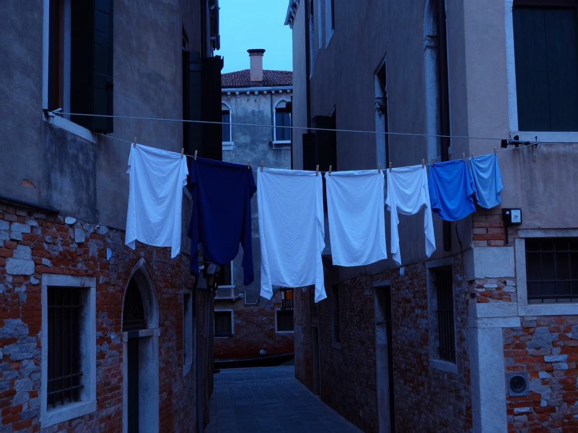 Venice Evening Blue Hour Laundry Hanging from Historic Building Facade in in Venice, Italy