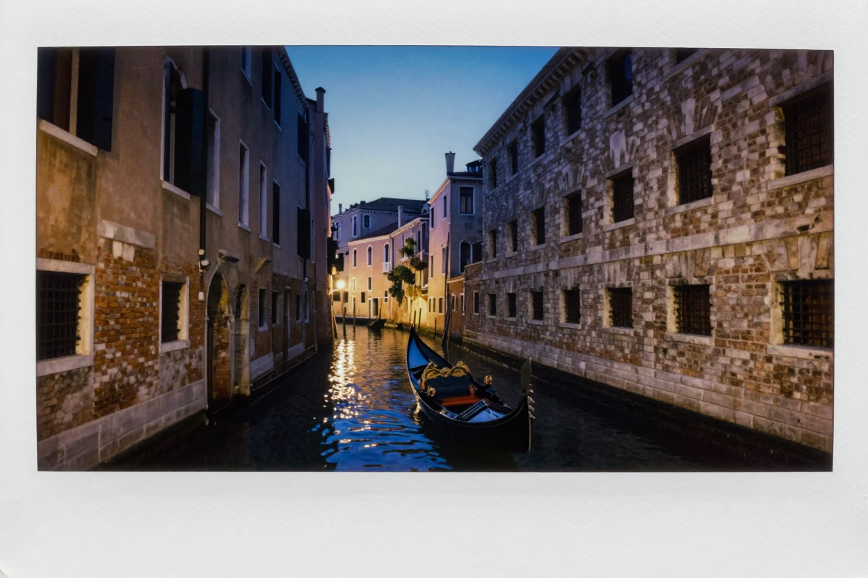 Venice Italy Canal Scene at Dusk with Traditional Gondola and City Lights in in Venice, Italy