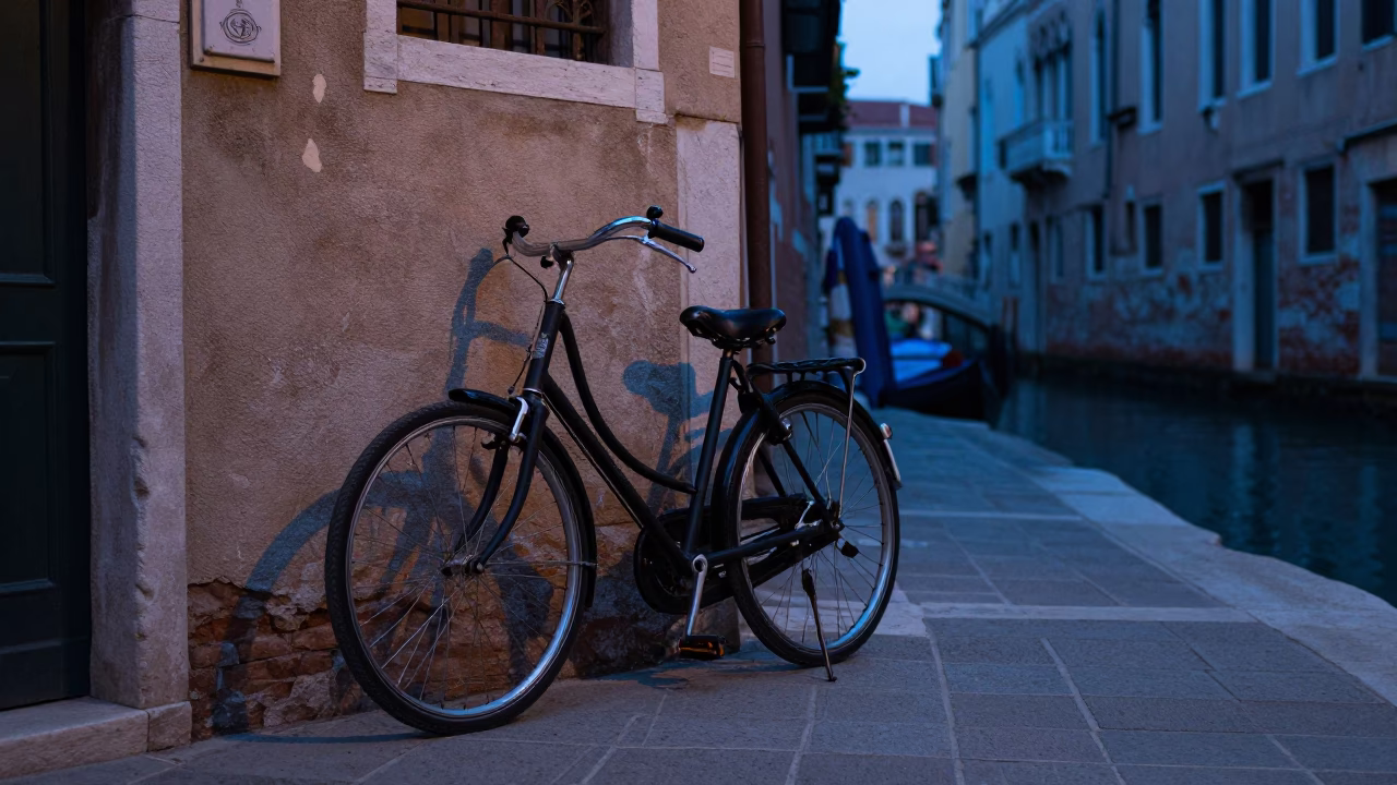 Venice Italy Evening Street Scene with Vintage Bicycle and Canal Reflections in in Venice, Italy