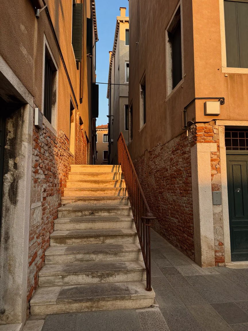 Venice Italy Golden Hour Street Scene with Rusty Stair Rail and Historic Architecture in in Venice, Italy