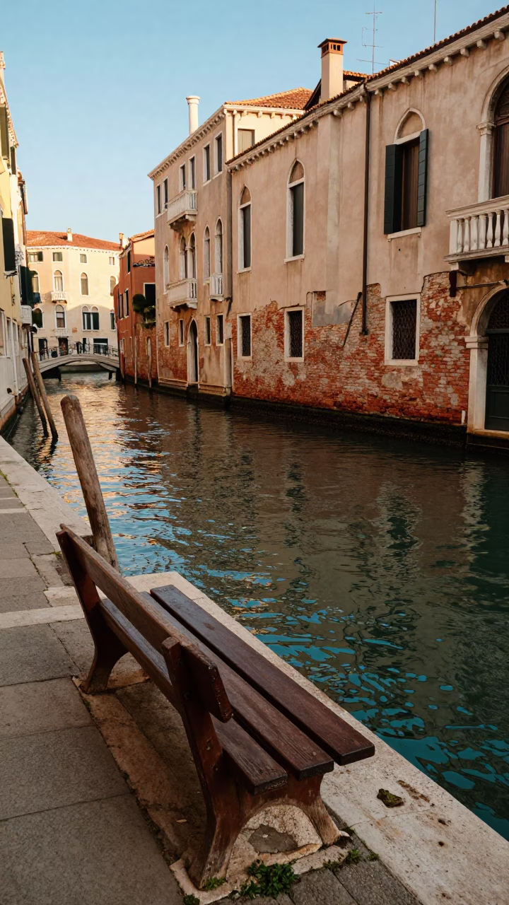 Venice Italy Late Afternoon Canal Scene with Wooden Bench and Apricots on Stone in in Venice, Italy