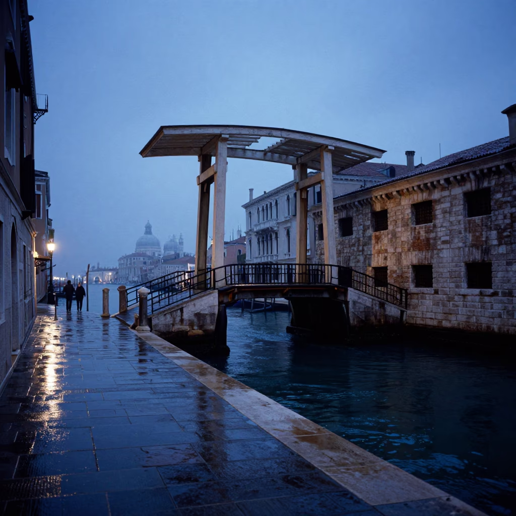 Venice Italy pre-dawn canal scene with drawbridge and wet stone reflections in in Venice, Italy