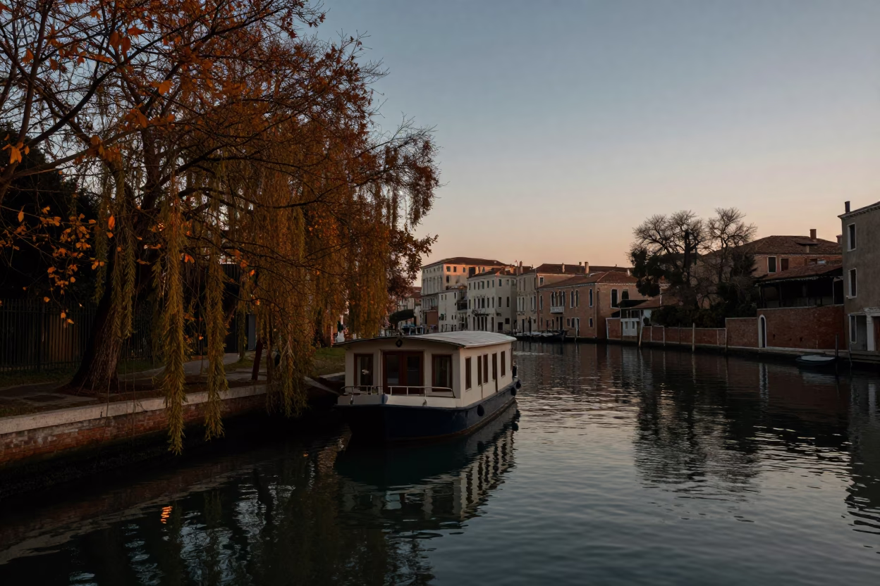 Venice Italy Pre-Dawn Canal Scene with Houseboat and Autumn Willows in in Venice, Italy