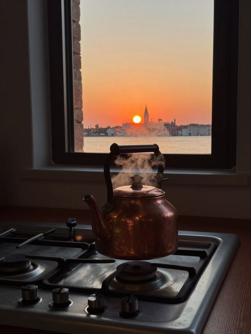 Venice Italy Sunset Stovetop Kettle Boiling on Traditional Gas Range with Canal View in in Venice, Italy