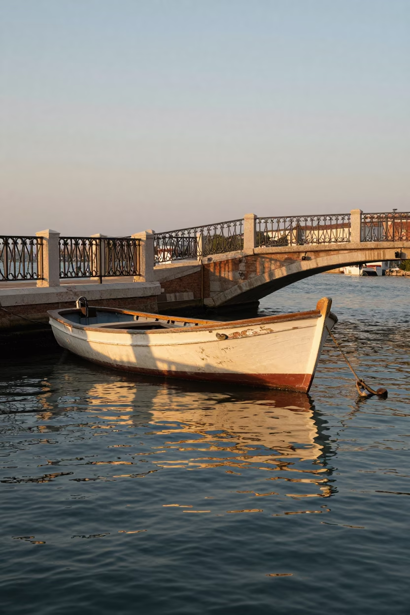 Venice Sunset Golden Hour Wooden Fishing Boat Moored Near Historic Canal Bridges in in Venice, Italy
