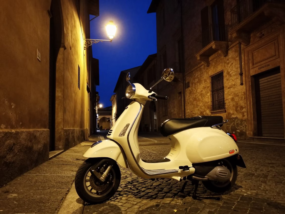 Vespa Parked in Bologna at The Deepest Night Sky Light in in Bologna, Italy