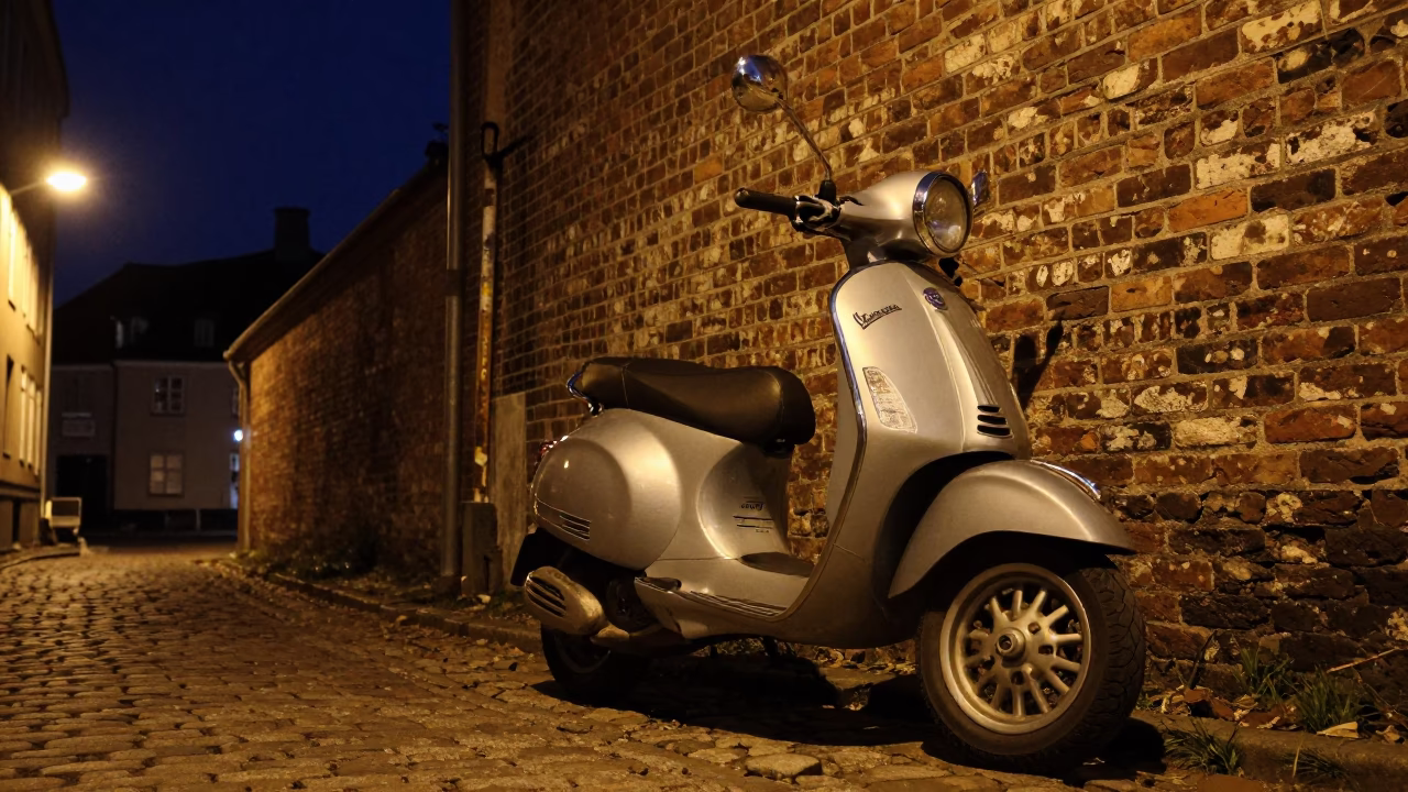 Vespa Parked in Copenhagen at The Deepest Night Sky Light in in Copenhagen, Denmark