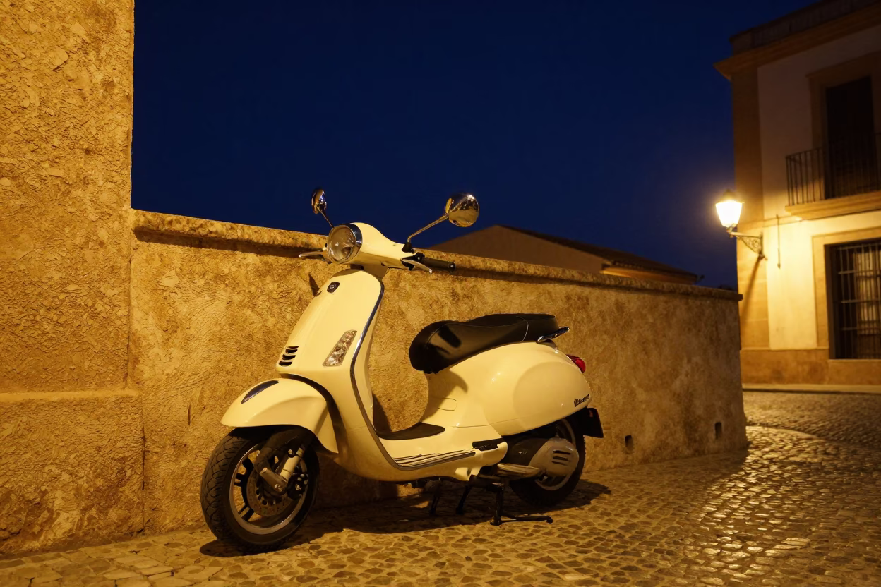 Vespa Parked in Valencia at The Deepest Night Sky Light in in Valencia, Spain