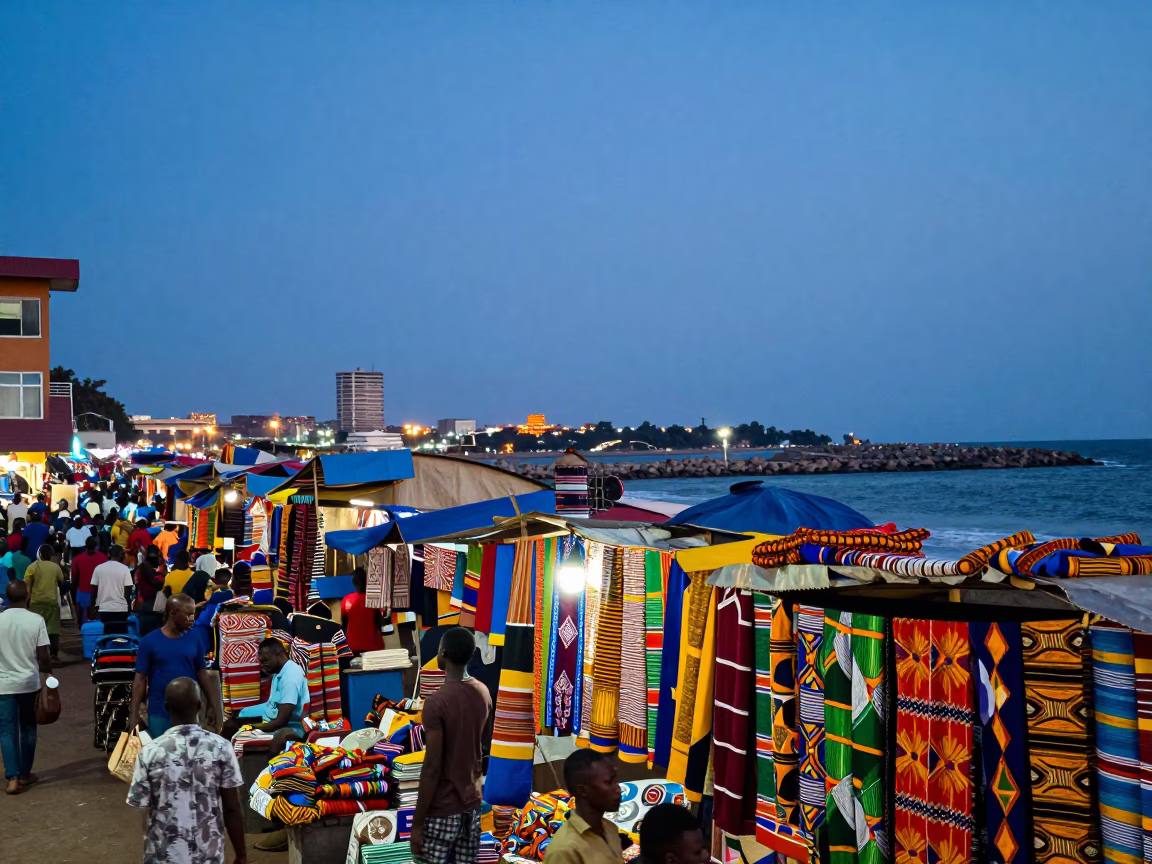 Vibrant Accra Street Market Scene at Blue Hour with Colorful Wares and City Lights in in Accra, Ghana