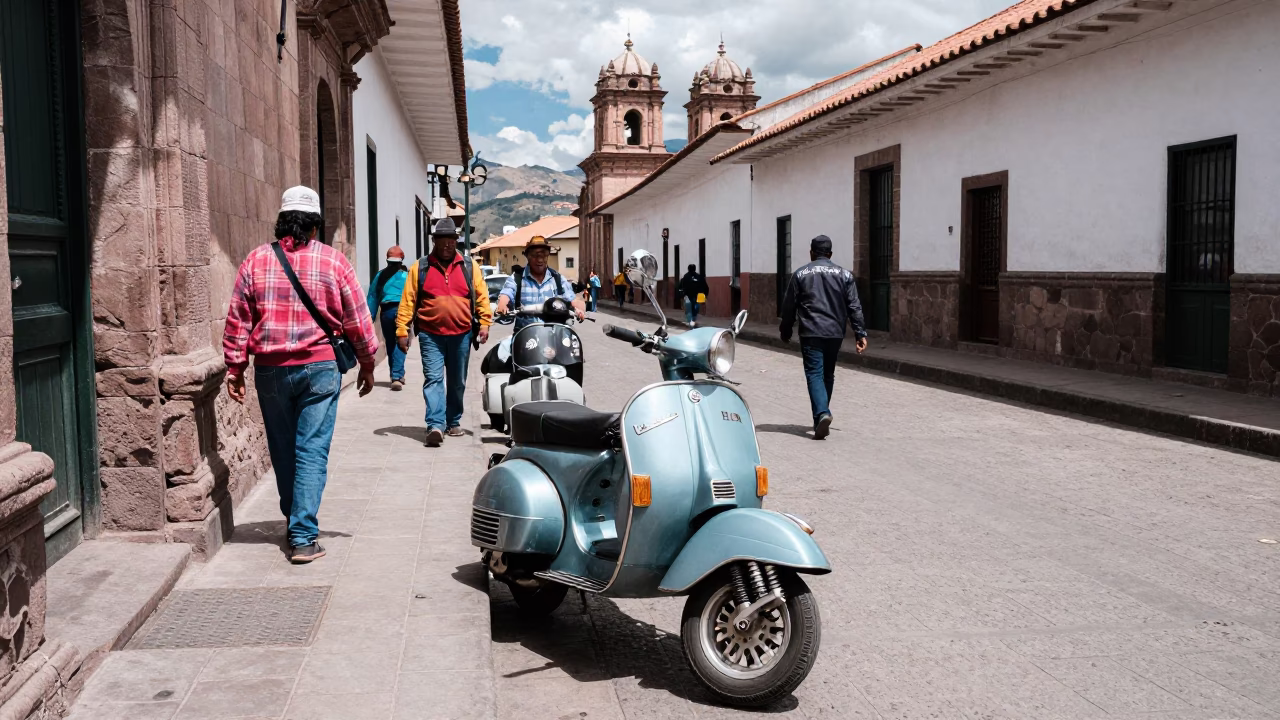 Vibrant Midday Street Scene in Cusco Peru With Vintage Vespa On Cobblestone Lane in in Cusco, Peru