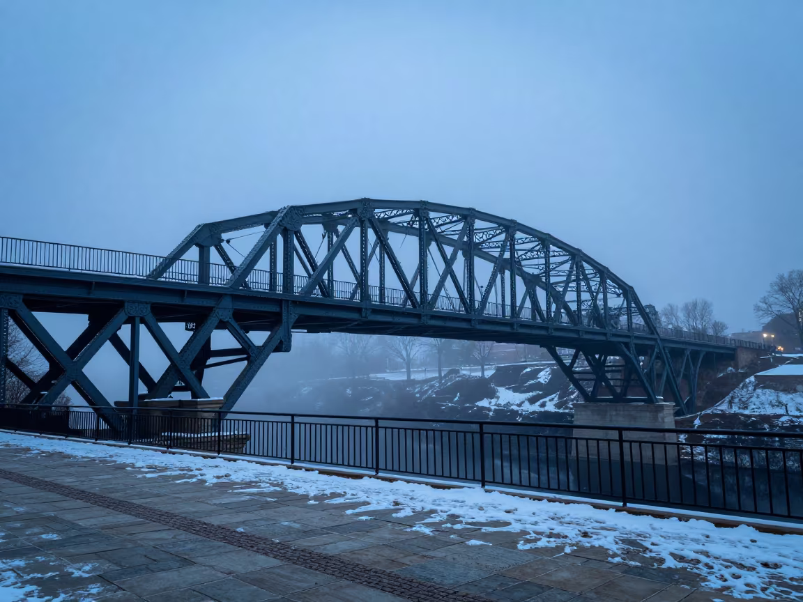 Victorian Iron Bridge Over Misty Gorge at Indigo Twilight in across a formal civic plaza in Ohio