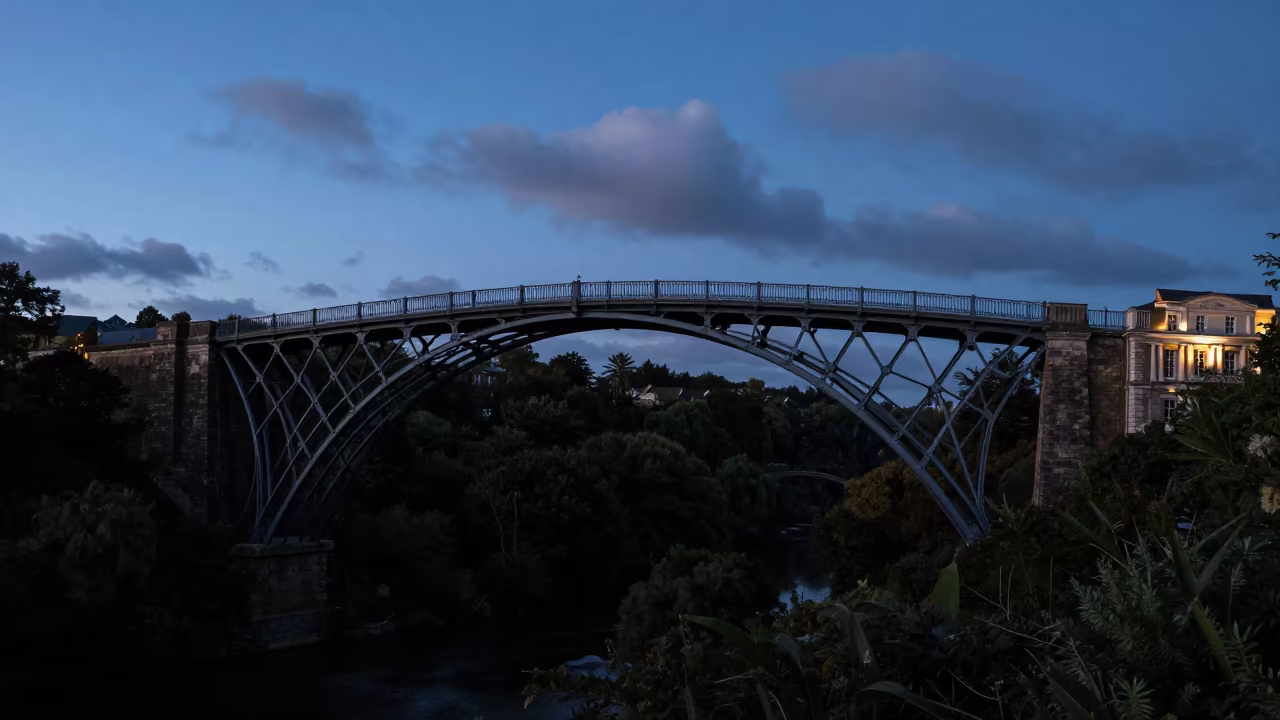 Victorian Iron Bridge Over Gorge at Blue Hour in along a colonnaded facade near Tuzla