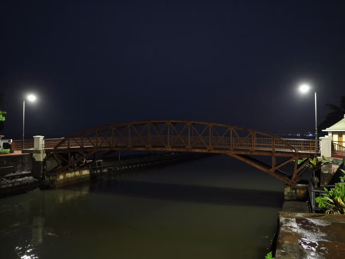Victorian Iron Footbridge Over Canal At Night in near Mumbai