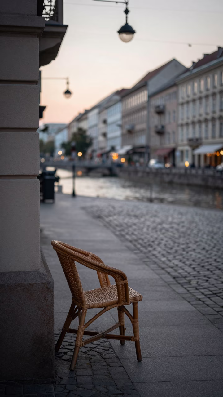 Vienna Austria Dawn Street Scene with Wicker Chair and Local Morning Life in in Vienna, Austria
