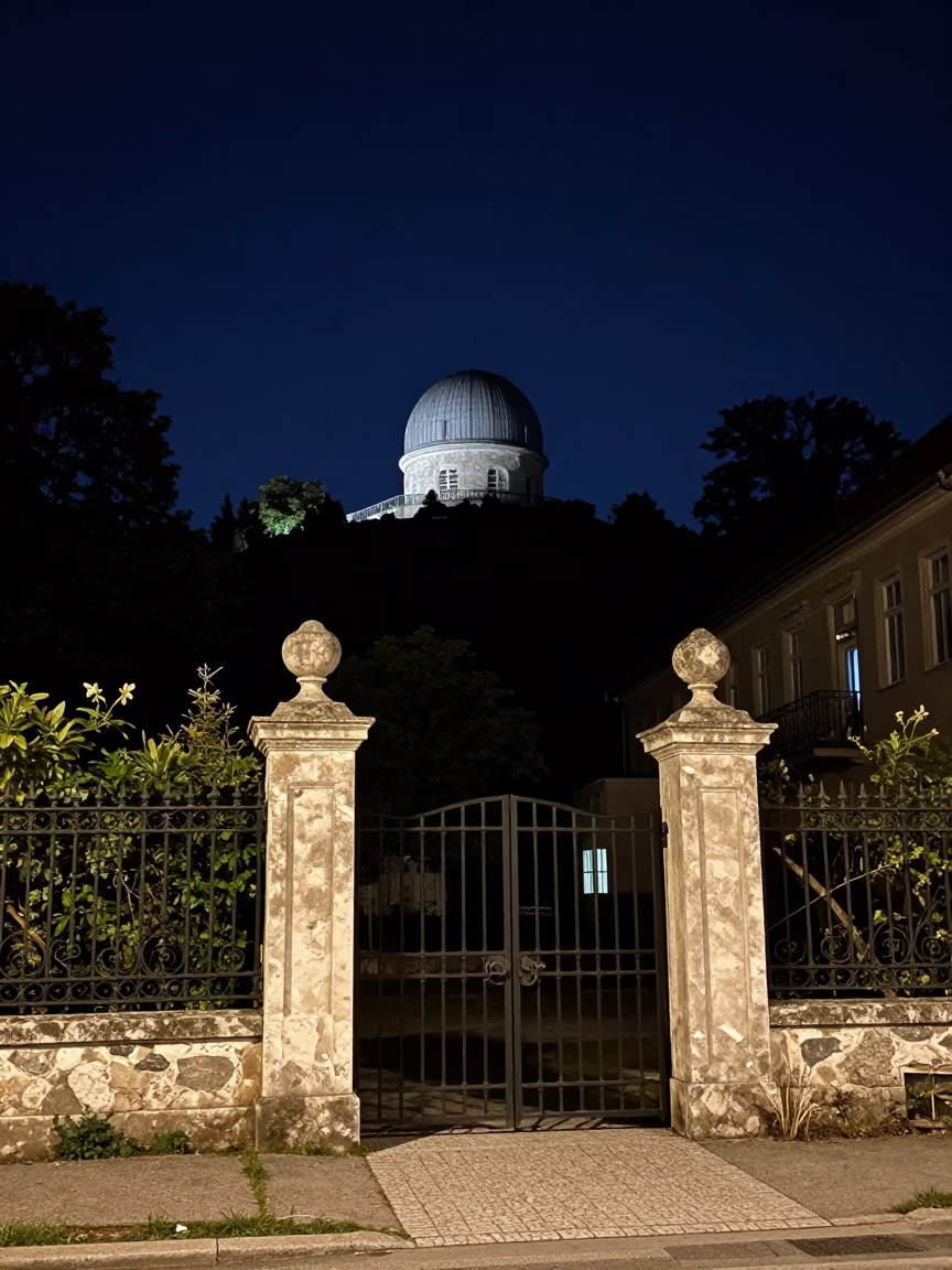 Vienna Austria Night Street Scene with Stone Observatory and Garden Gate in in Vienna, Austria