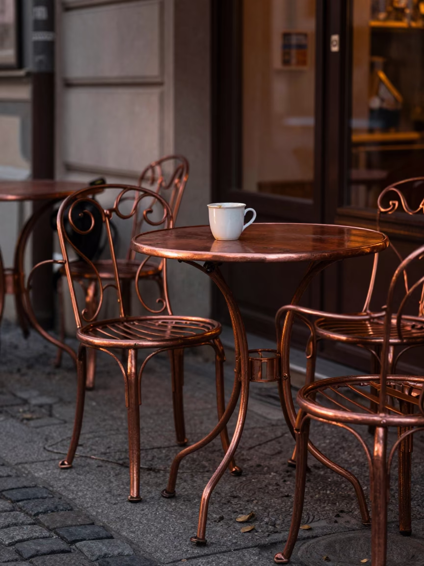 Vienna Cafe Outdoor Seating in Copper Dusk Light with Lantern and Tea Stains in in Vienna, Austria