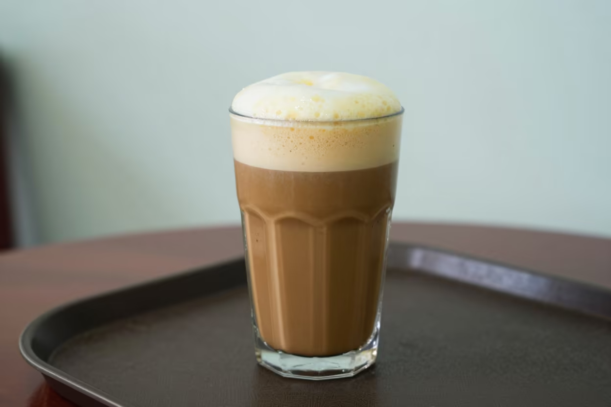 Vietnamese Egg Coffee Foam on Tea House Tray in on a tea house tray in Vinh