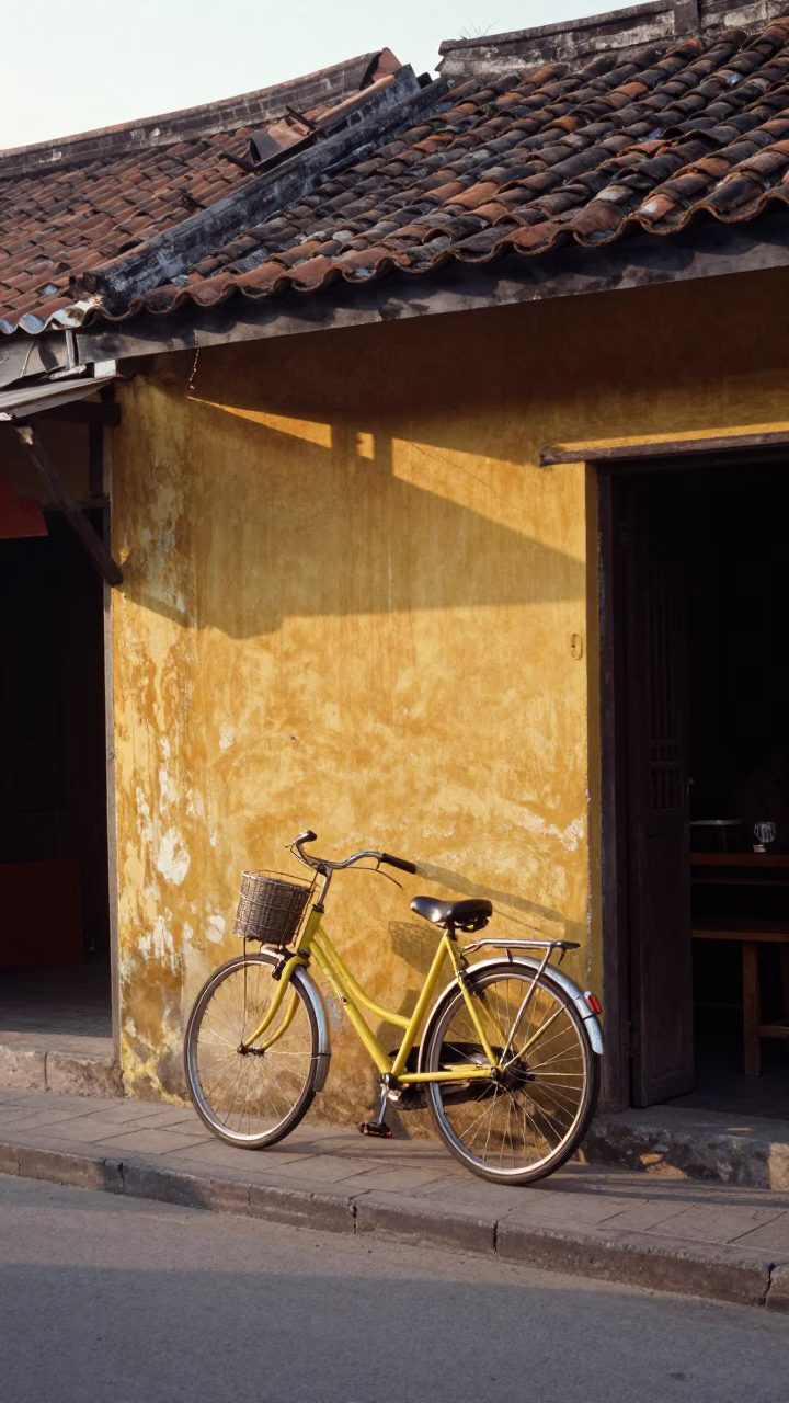Vintage 1960s Hoi An Vietnam street scene with bicycle and morning light in in Hoi An, Vietnam