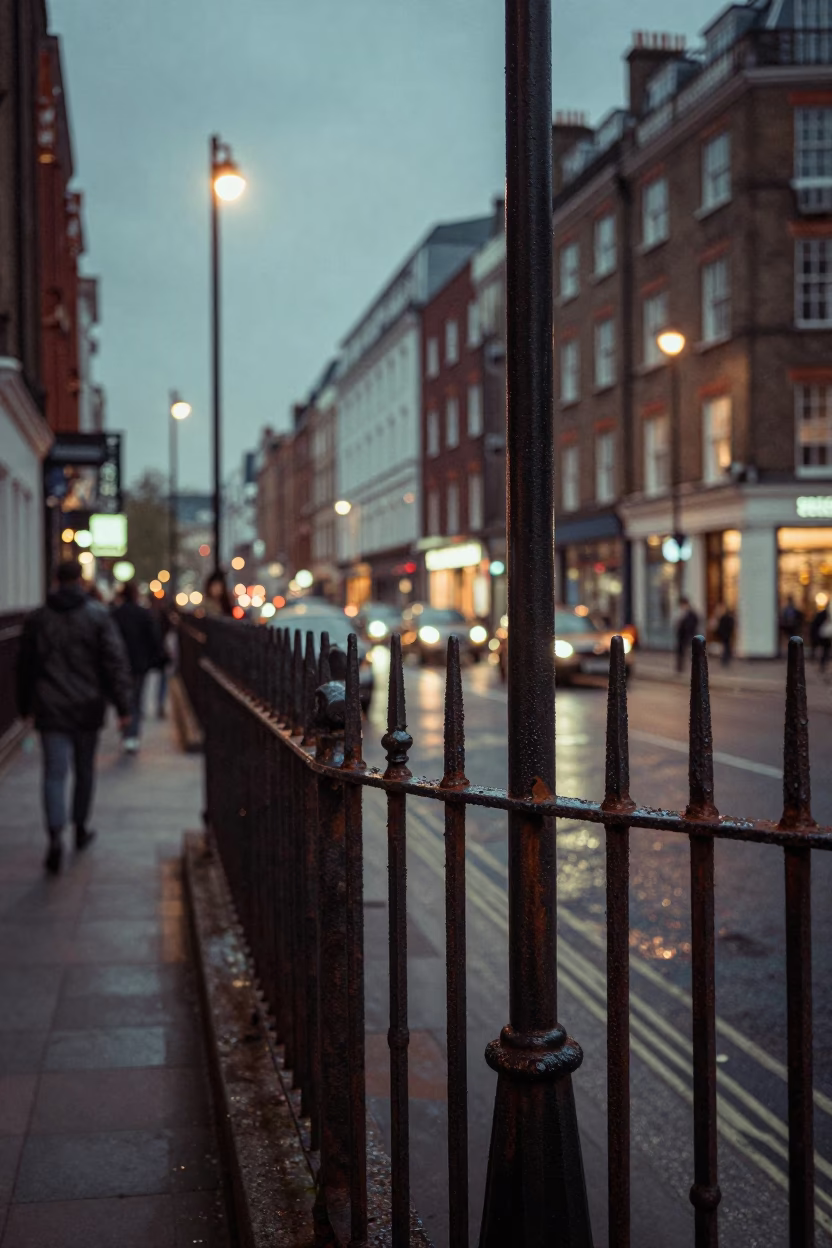 Vintage 1960s London Street Scene with Substation Fence and Warning Placards at Dusk in in London, United Kingdom