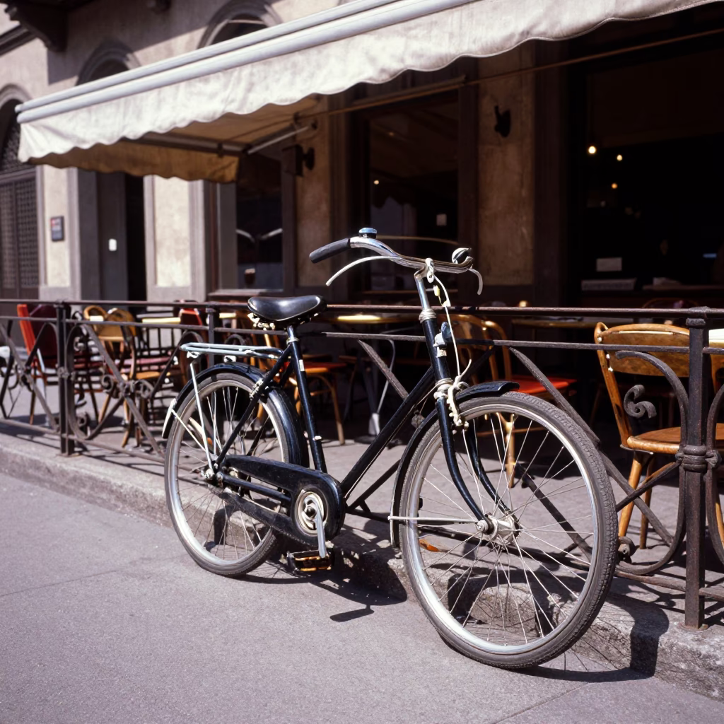 Vintage 1960s Milan Street Scene with Bicycle Leaning Against Cafe Under Noon Sun in in Milan, Italy