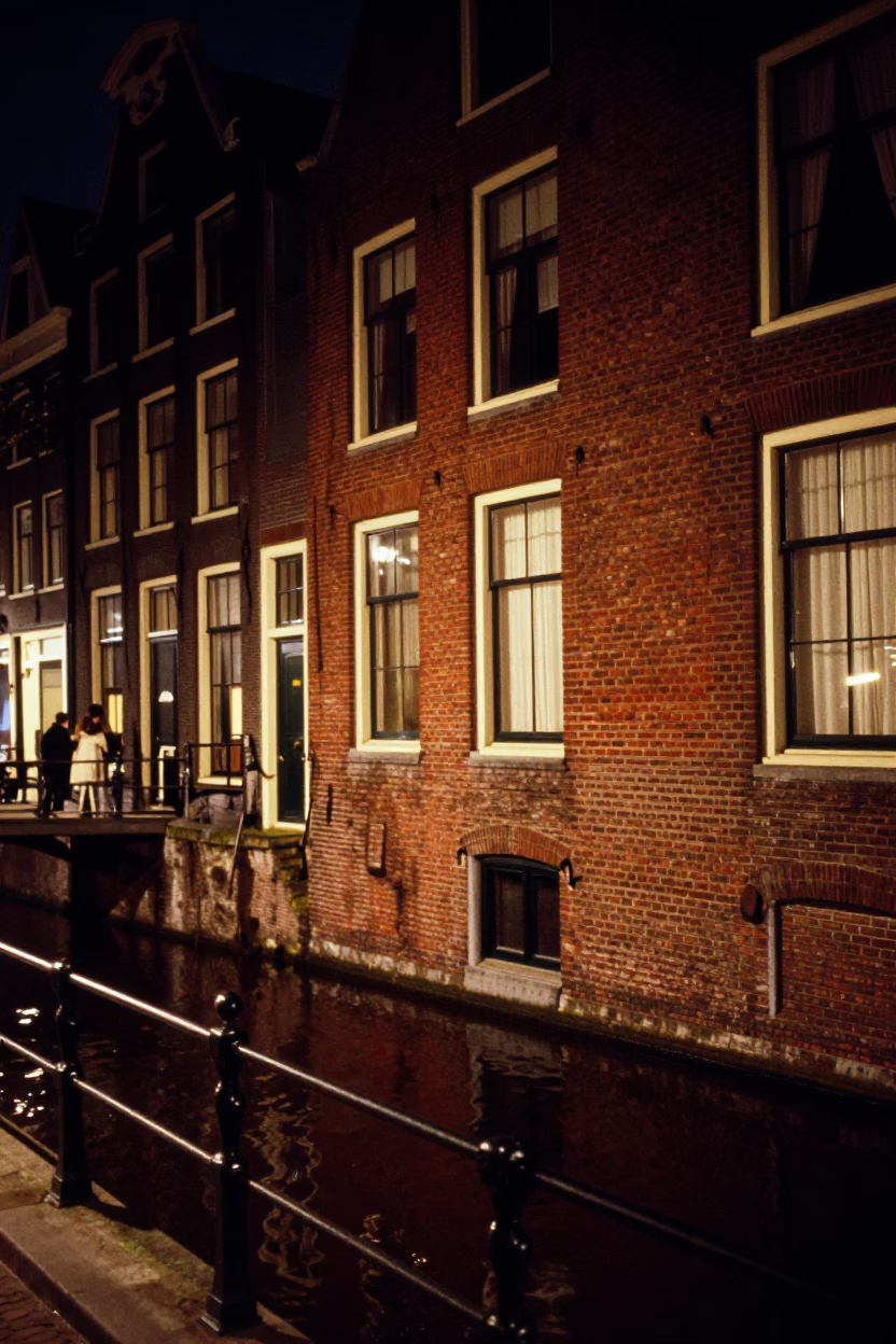 Vintage 1970s Amsterdam Night Scene with Red Brick Canal House and Fire Engine in in Amsterdam, Netherlands