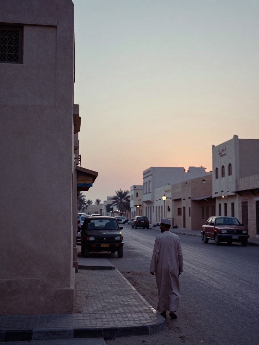 Vintage 1970s Muscat Oman Street Scene Before Sunrise with Local Interaction in in Muscat, Oman