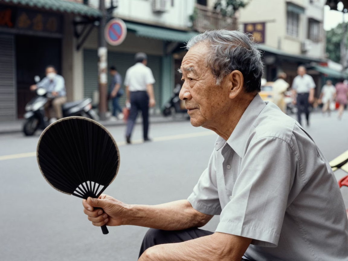 Vintage 1970s Taipei street scene with elderly man and folding fan in in Taipei, Taiwan