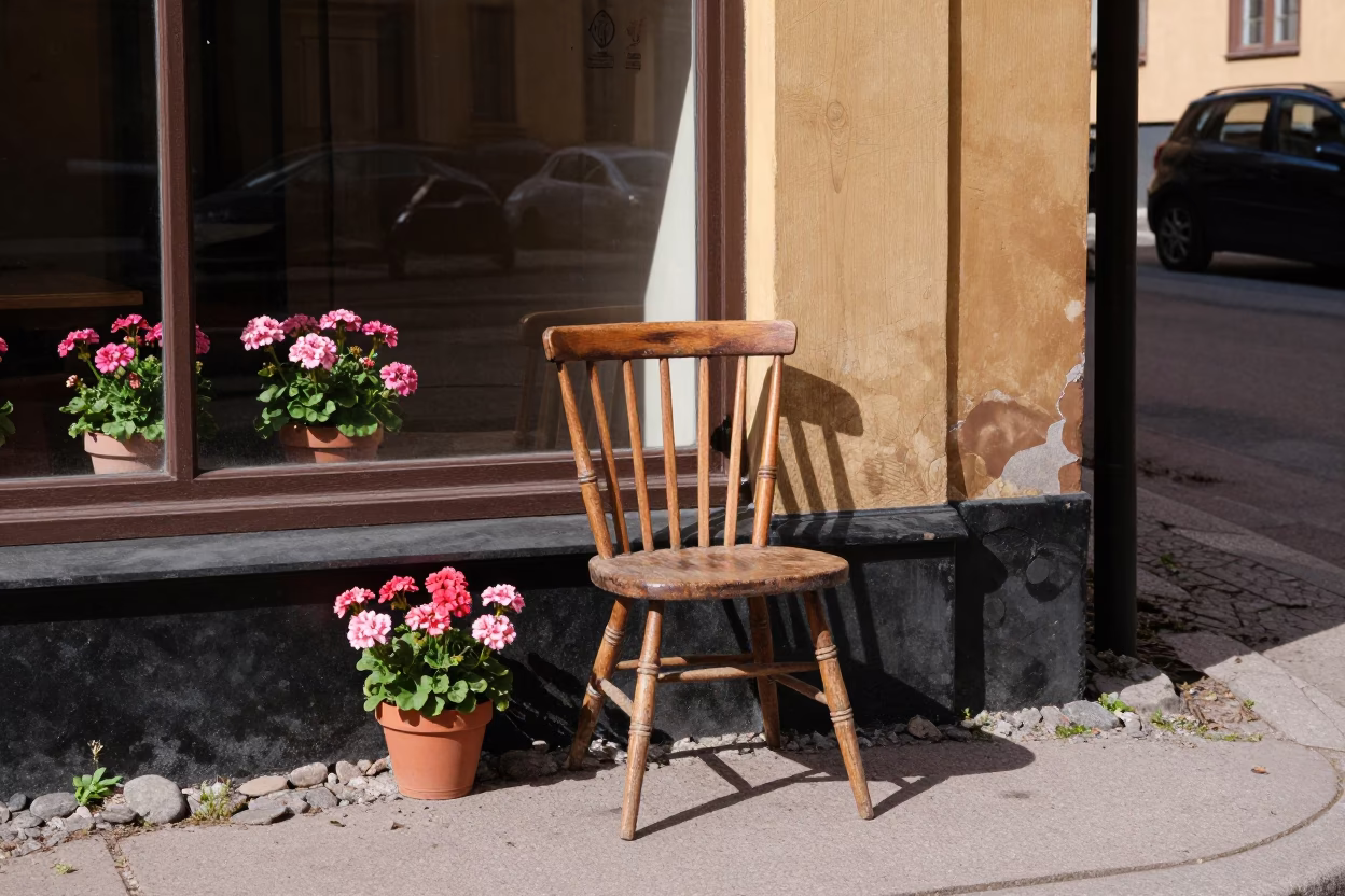 Vintage 1980s Stockholm Midday Street Scene with Potted Geraniums and Traditional Spindle Chair in in Stockholm, Sweden