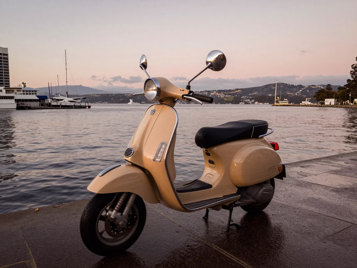 Vintage 1990s Hobart Tasmania Scooter Parked on Harbor Promenade in Copper Dusk Light in in Hobart, Tasmania, Australia