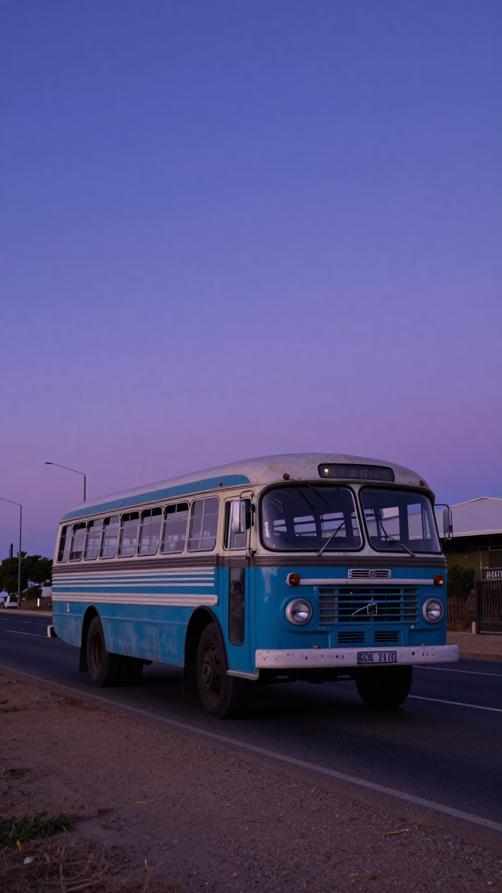 Vintage Bedford Bus Arriving in Cape Town Indigo Twilight Street Scene in in Cape Town, South Africa