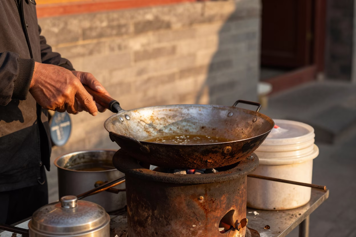 Vintage Beijing Street Scene with Rusty Skillet and Hand Towels in Honeyed Evening Light in in Beijing, China