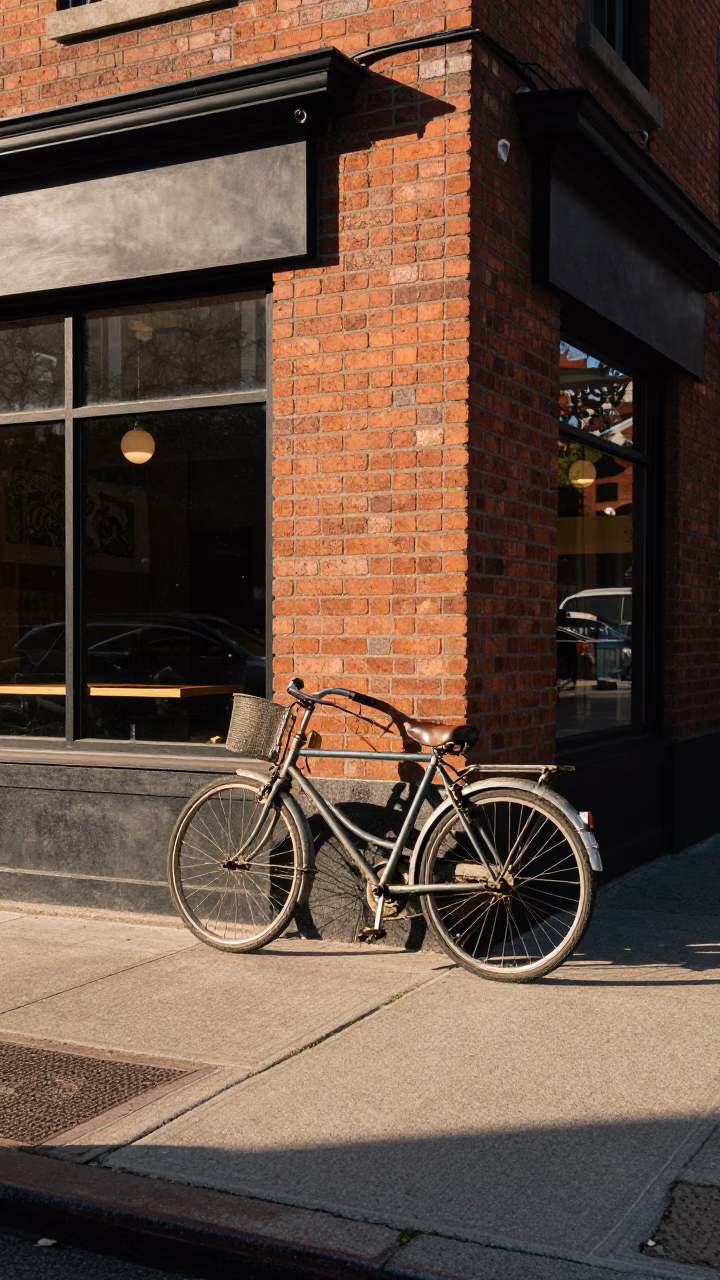 Vintage bicycle leaning against a cafe exterior in early afternoon Toronto Ontario Canada in in Toronto, Ontario, Canada