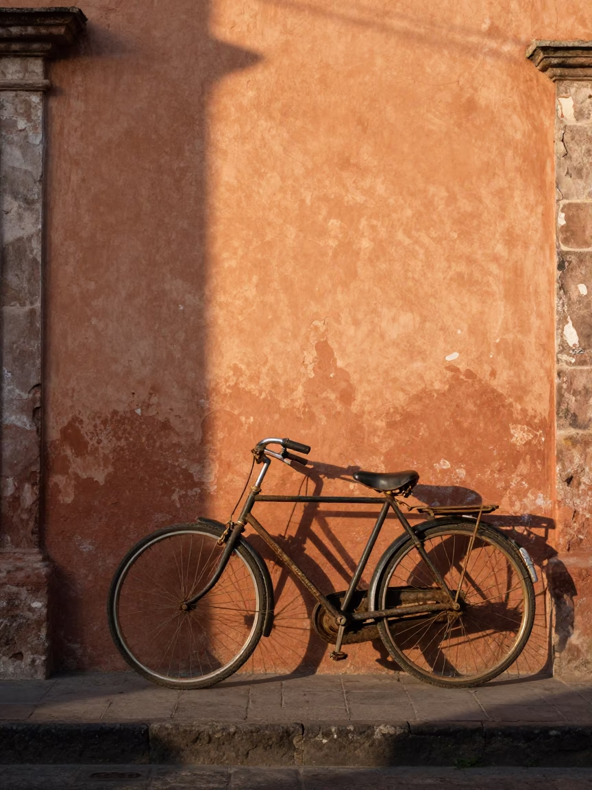 Vintage Bicycle Leaning Against Adobe Wall in Mexico City Morning Light in in Mexico City, Mexico