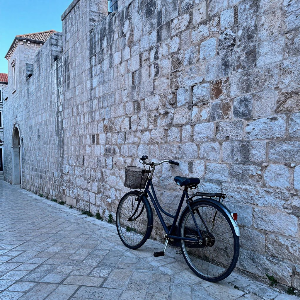 Vintage Bicycle Leaning Against Ancient Stone Wall in Dubrovnik Croatia Before Sunrise in in Dubrovnik, Croatia