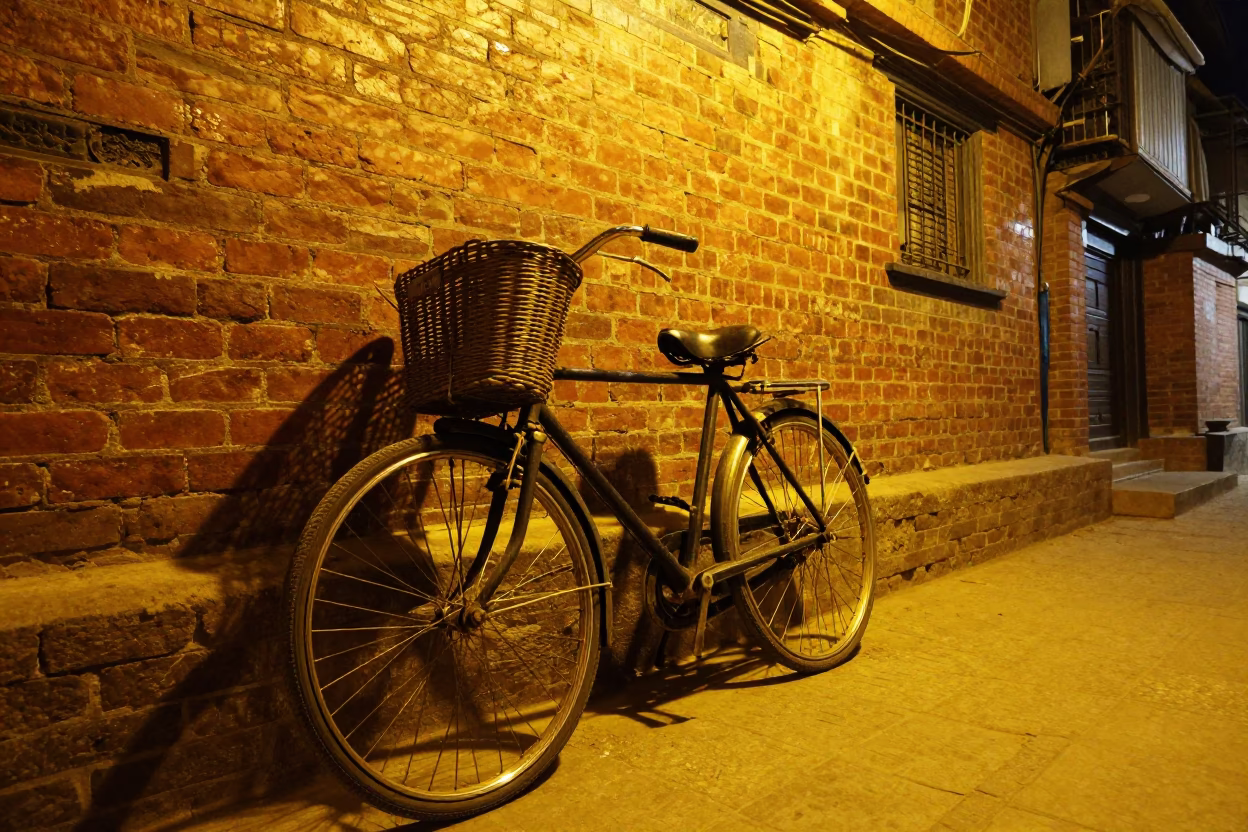 Vintage Bicycle Leaning Against Brick Wall in Kathmandu Night Street Scene in in Kathmandu, Nepal