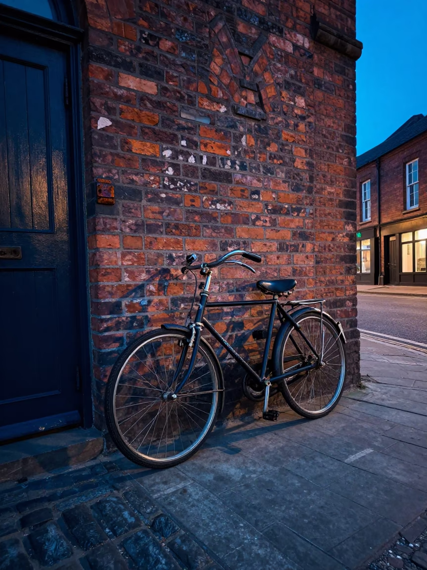 Vintage Bicycle Leaning Against Brick Wall in Liverpool Indigo Twilight Street Scene in in Liverpool, United Kingdom