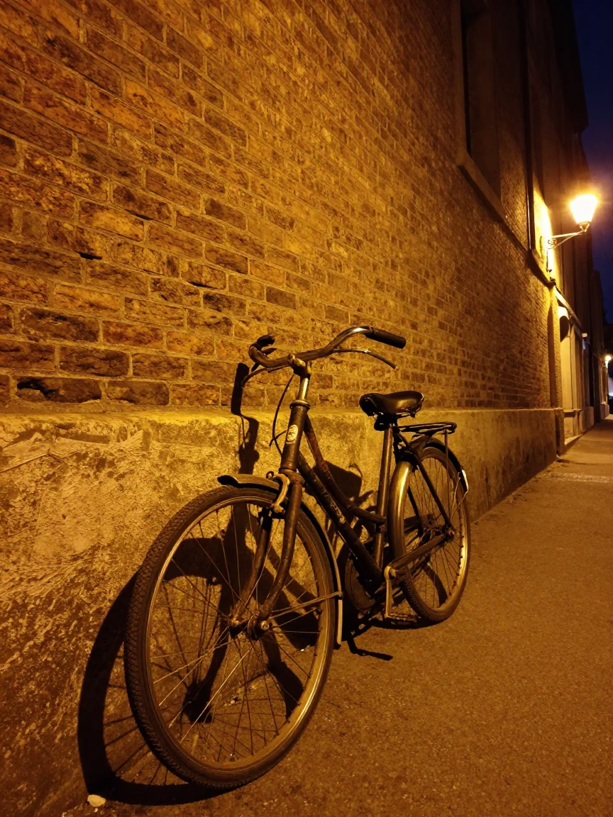 Vintage Bicycle Leaning Against Brick Wall in Lyon France Night Street Scene in in Lyon, France