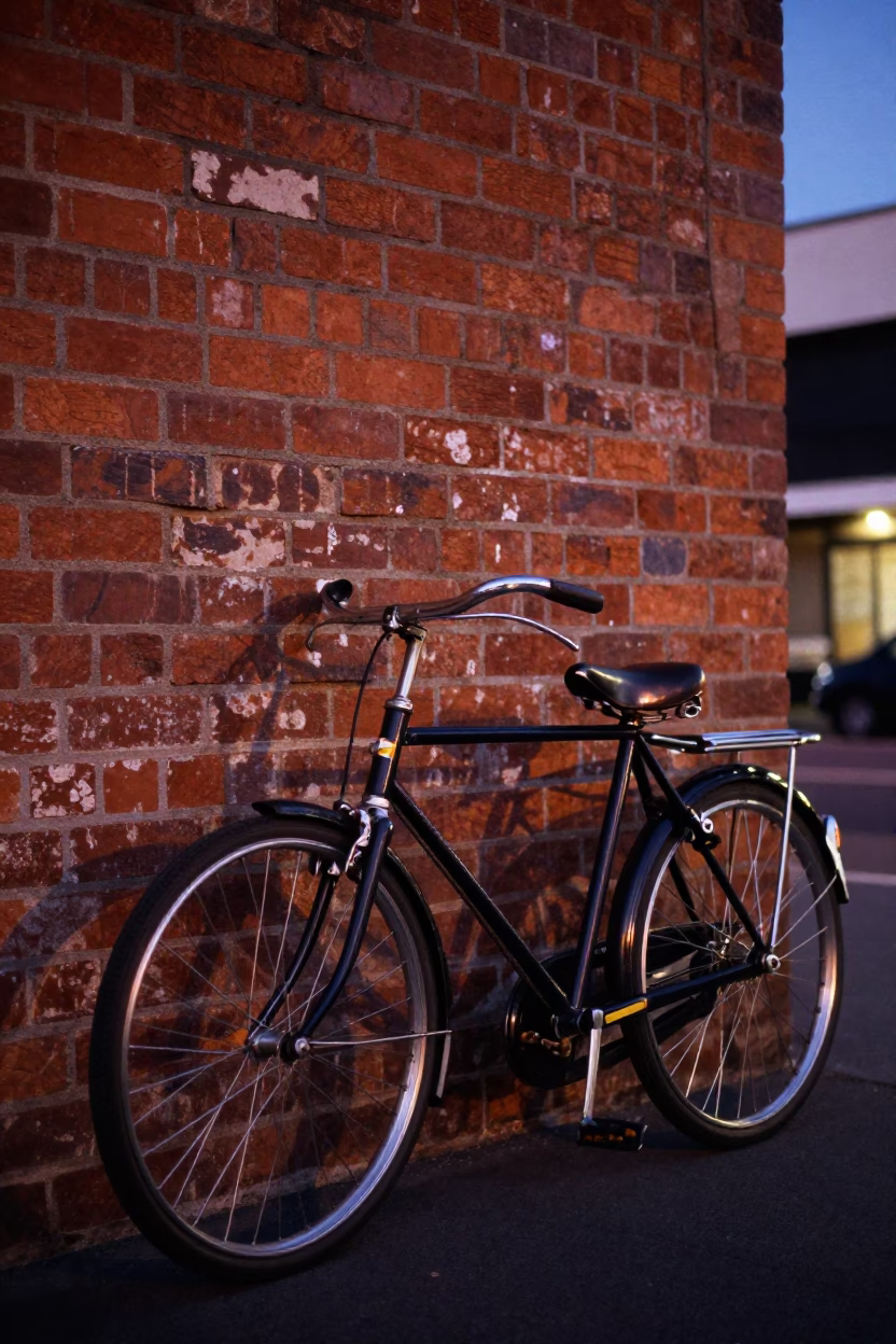Vintage Bicycle Leaning Against Brick Wall in Melbourne Blue Hour Street Scene in in Melbourne, Victoria, Australia