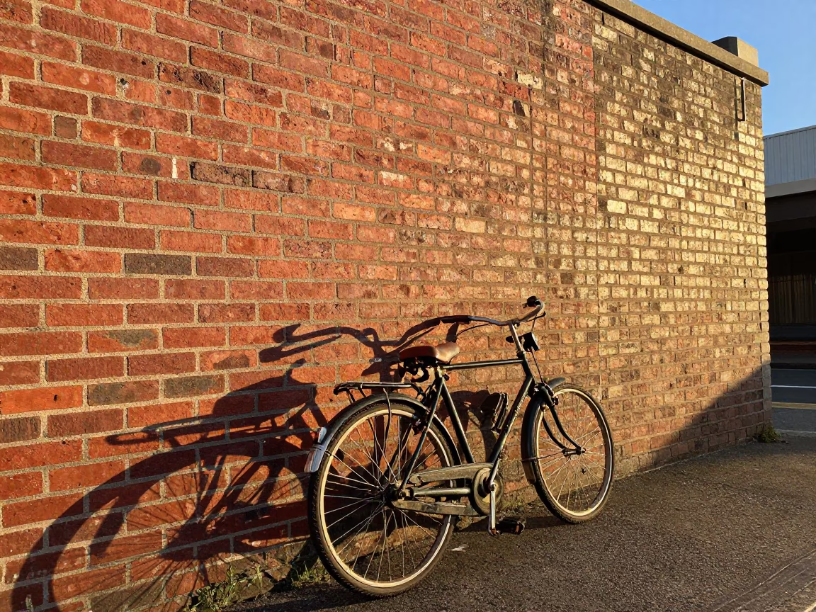 Vintage Bicycle Leaning Against Brick Wall in Perth Western Australia at First Light in in Perth, Western Australia, Australia