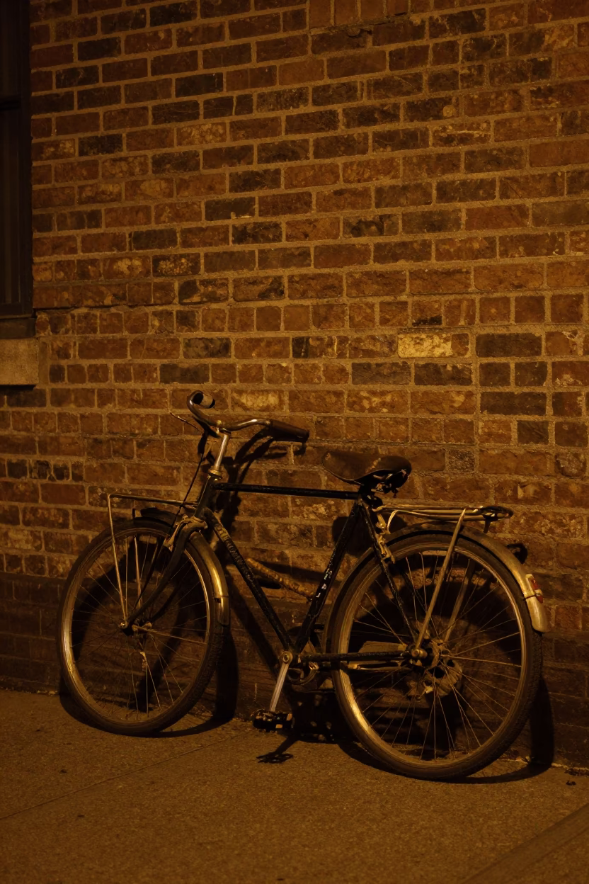 Vintage Bicycle Leaning Against Brick Wall in Philadelphia Night Street Scene in in Philadelphia, Pennsylvania, United States