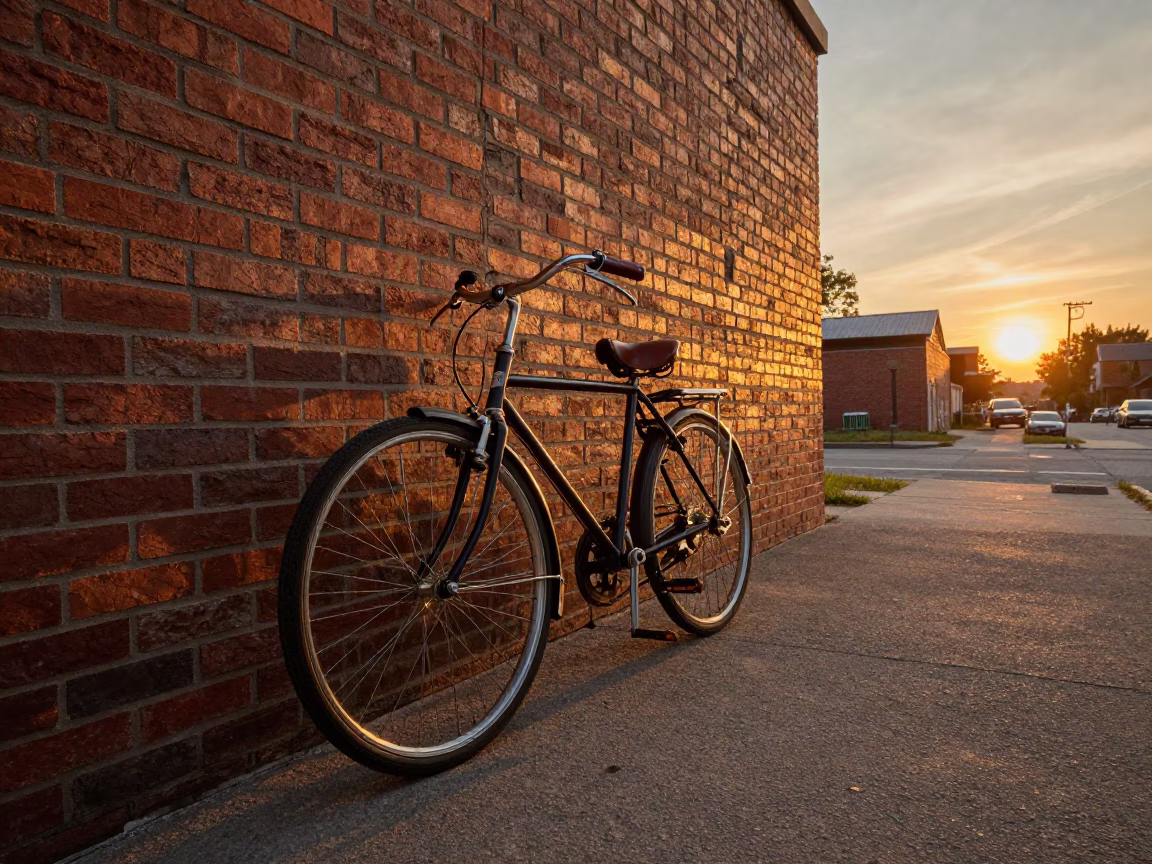 Vintage Bicycle Leaning Against Brick Wall in Toronto Ontario at Sunset in in Toronto, Ontario, Canada