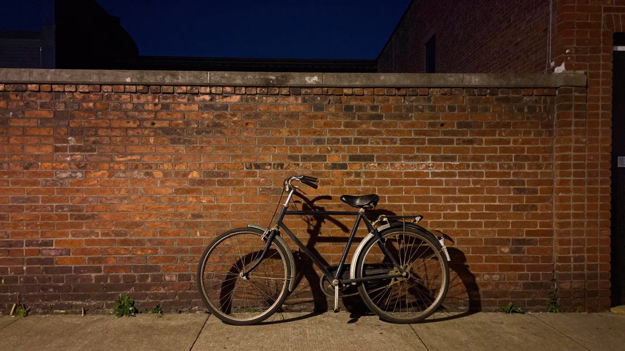 Vintage Bicycle Leaning Against Brick Wall Under Nashville Night Sky in in Nashville, Tennessee, United States