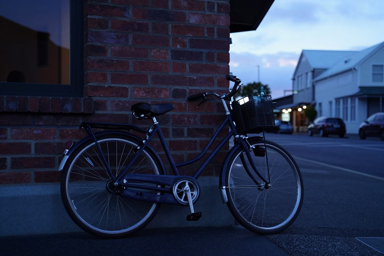 Vintage Bicycle Leaning Against Christchurch Cafe Before Sunrise with Morning Light in in Christchurch, New Zealand