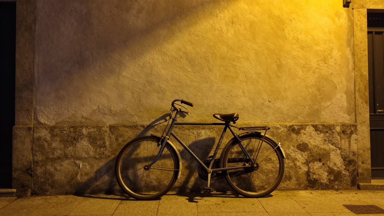 Vintage Bicycle Leaning Against Lime Washed Wall in Porto Portugal Late Night Street Photography in in Porto, Portugal