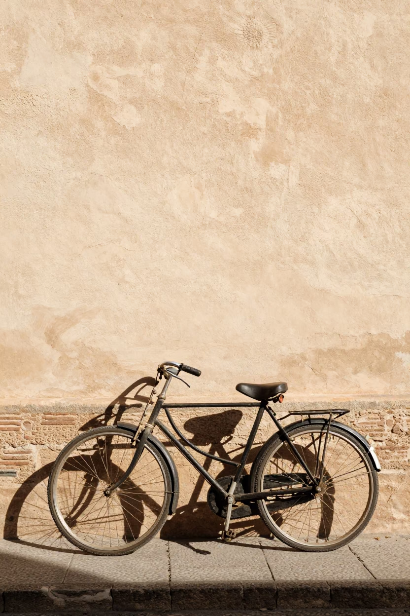 Vintage Bicycle Leaning Against Sunlit Alhambra Wall in Granada Spain Noon in in Granada, Spain