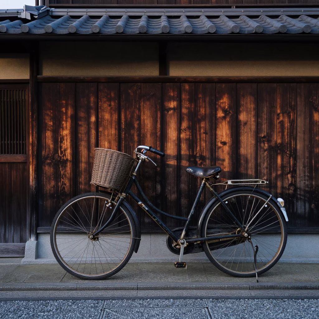 Vintage Bicycle Leaning Against Traditional Kyoto Wall in Early Evening Light in in Kyoto, Japan
