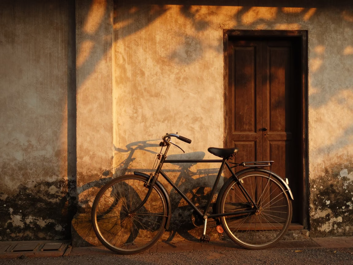 Vintage Bicycle Leaning Against Wall in Chiang Mai Evening Light with Door Latch Detail in in Chiang Mai, Thailand